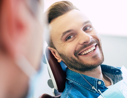 Man smiling at dentist in treatment chair