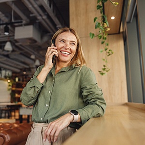 Woman smiling while talking on phone
