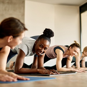 Group of women smiling during workout class