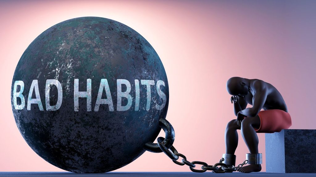 A CGI image of a man with a bad habits weight around his ankle.