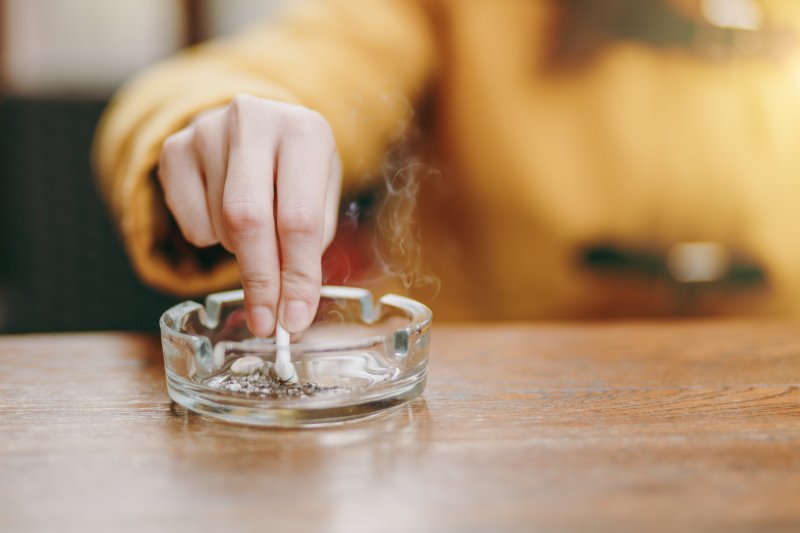 Patient putting out a cigarette